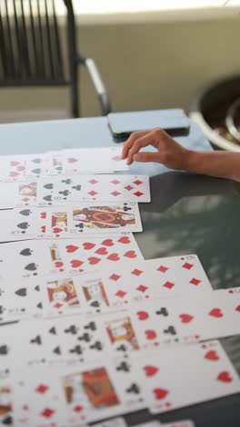 person playing cards outdoors