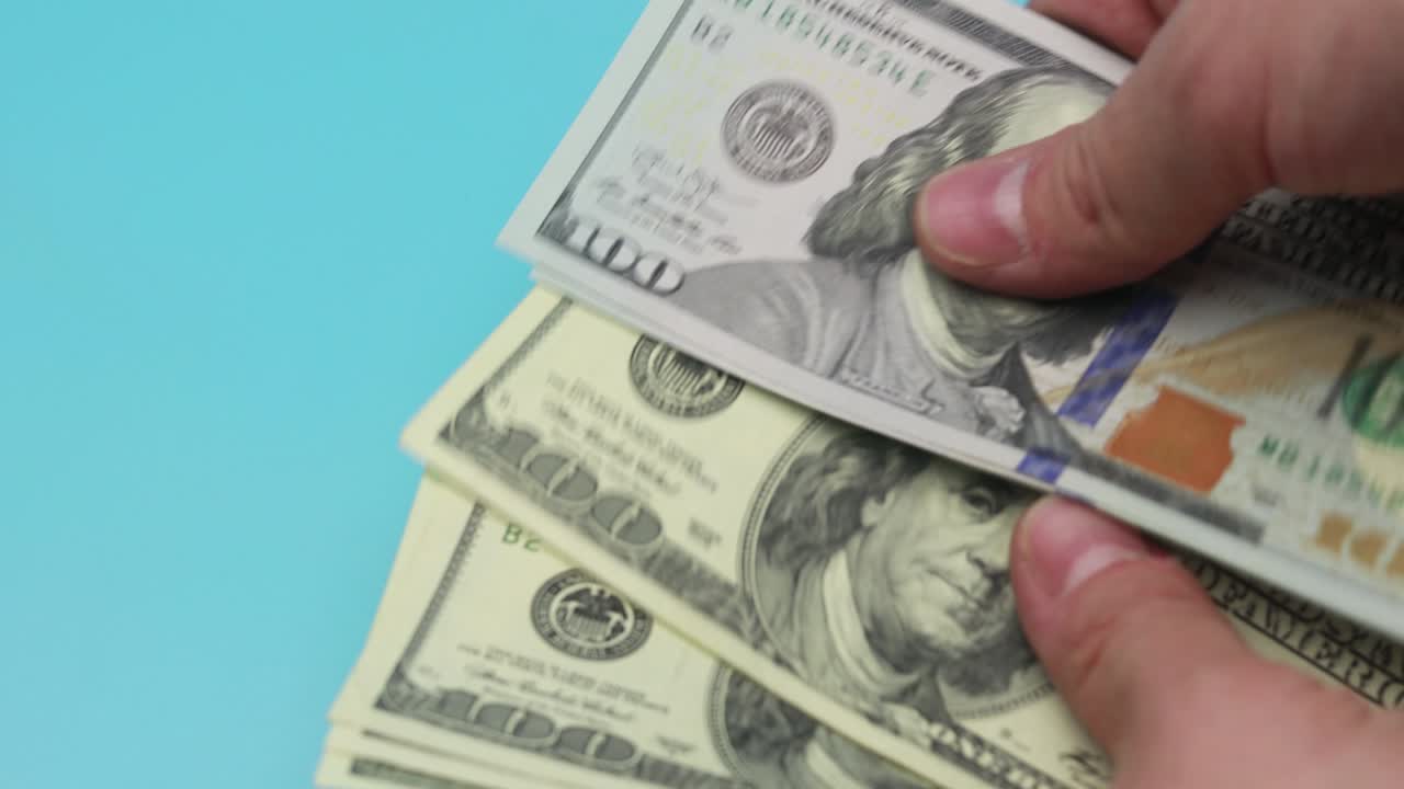 Loop hands count dollars of different years of countries