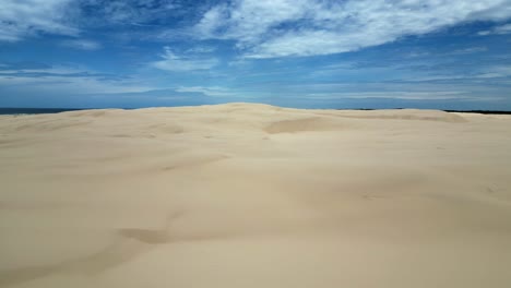 aerial shot of the empty shifting sand dunes at stockton beach