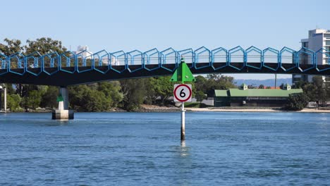 bridge and waterway with speed limit sign