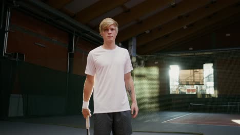 man standing on a tennis court