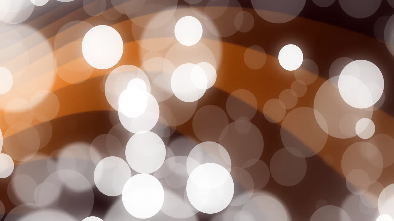 Warm brown and white circular bokeh lights creating abstract animation effect