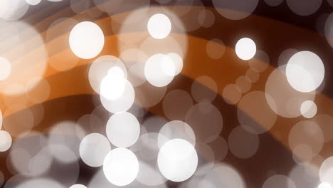 warm brown and white circular bokeh lights creating abstract animation effect