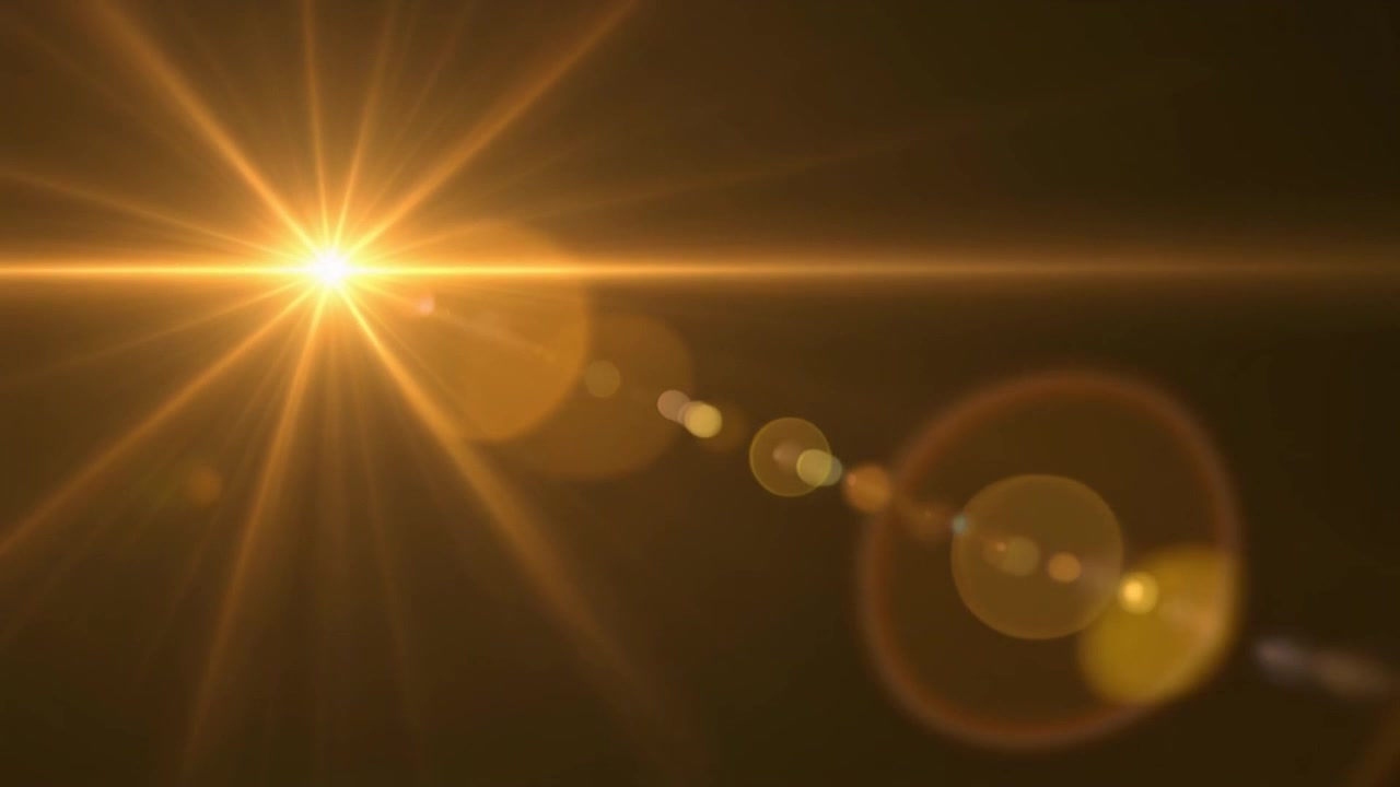 Effetto Flare Lente Dorato su Sfondo Scuro