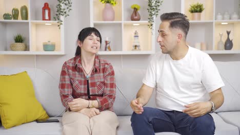 Married-couple-overwhelmed-by-the-heat-at-home.