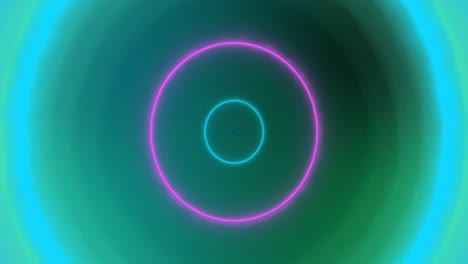 animación de círculos de neón pulsantes amarillos, azules, rosados y verdes sobre fondo verde