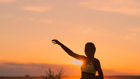 Middle-plan-female-volleyball-player-at-sunset-putting-a-back-on-the-ball-in-slow-motion.