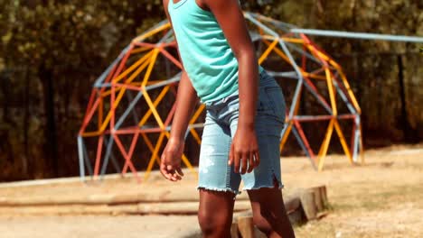 Schoolgirl-standing-in-school-playground