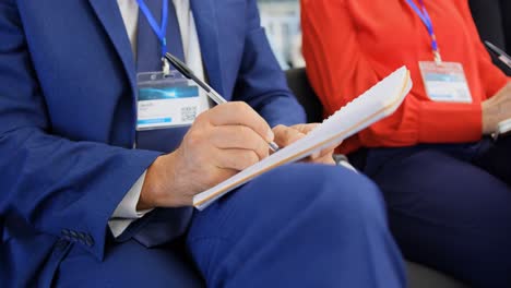 business people writing on notepad in the business seminar 4k