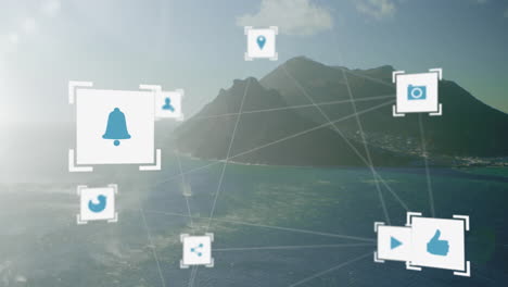 icons and network connections animation over coastal landscape with mountains