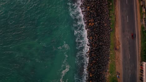 stunning aerial footage capturing the breathtaking weligama coastline bathed in the warm hues of sunset.