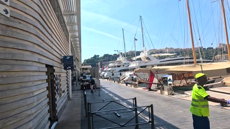 view of pier, yachts, and building signs