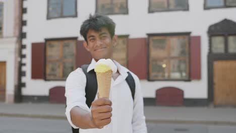 melting ice cream cone in the summer at an old town in europe