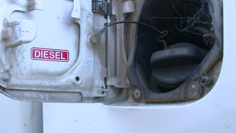 tight shot of an old diesel truck gas tank