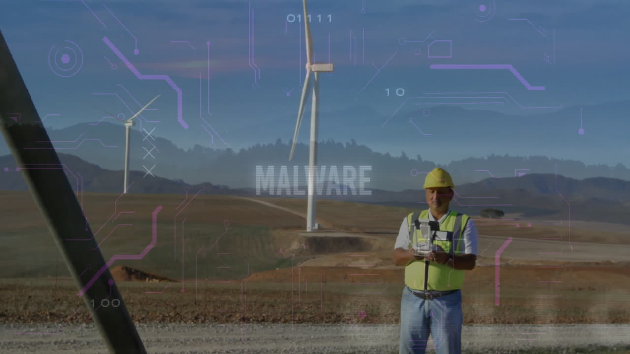 Construction worker using drone controller at wind farm, showing malware overlay and binary digits