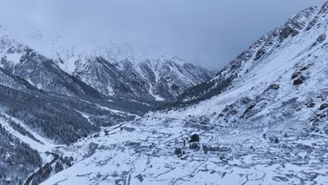 Snowy Mountain Valley with Cabin