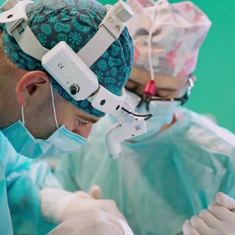 surgery in hospital operating theater. surgeons working on patient in operating room