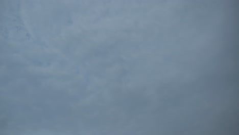 Time-lapse-shot-upwards-from-the-beautiful-blue-sky-with-fast-passing-clouds