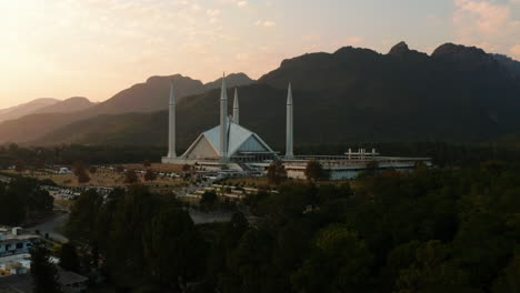 faisal mosque at sunset - faisal masjid with margalla hill range in background in pakistan