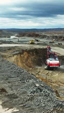 large-scale open-pit mining operation with heavy machinery