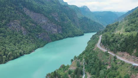 Aerial-view-from-drone-of-a-river-amongst-mountains-and-the-beautiful-nature-in-Georgia