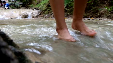 women walking at waterfall, natural therapy