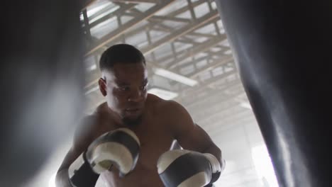 video of fit african american man boxing at gym