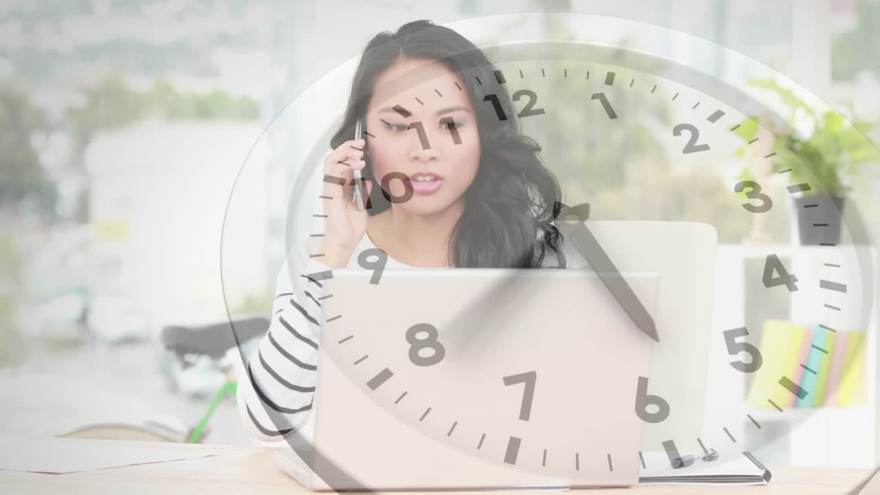 Office manager reacting to clock overlay appearing while making phone call and discussing project