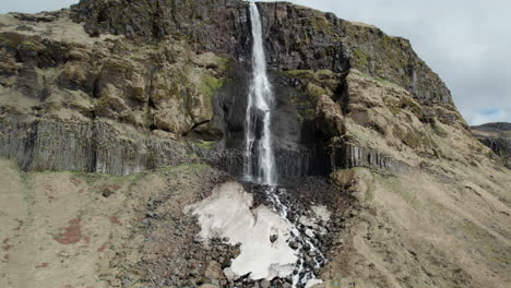 Bjarnarfoss-waterfall:-aerial-zoom-out-shot-of-a-fantastic-Icelandic-waterfall