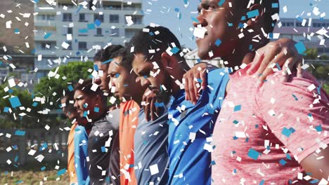 Animation-of-confetti-falling-over-male-football-team-standing-and-embracing-before-game