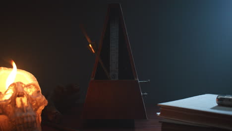 metronome set the rythm in the dark, old room