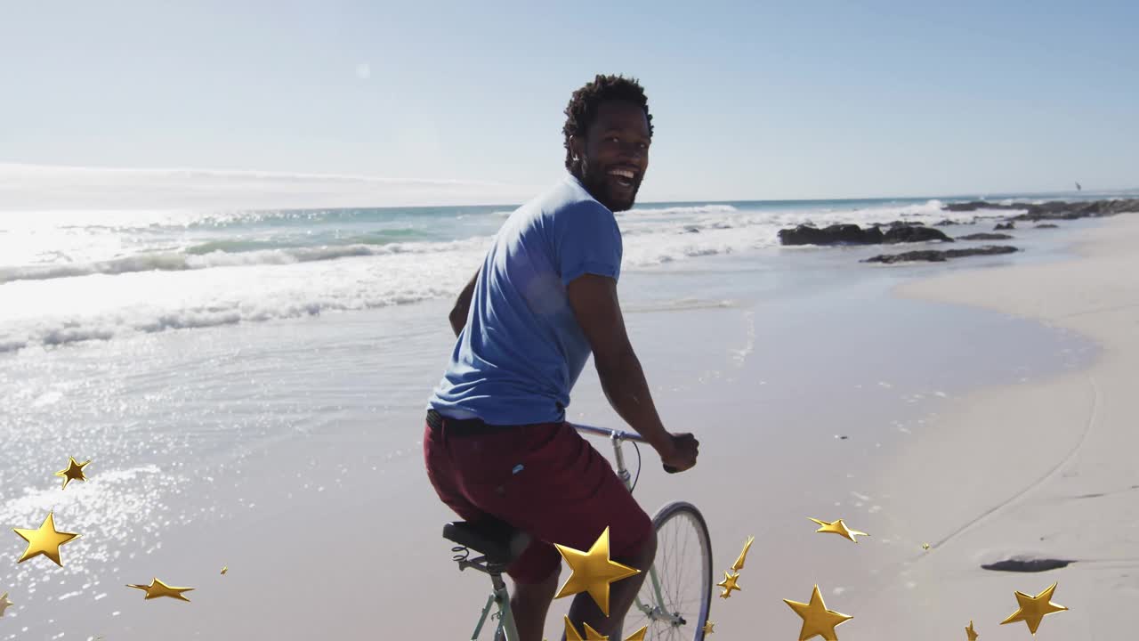 Man pedaling bicycle on wet sand initiating golden stars swirling highlighting motion for marketing