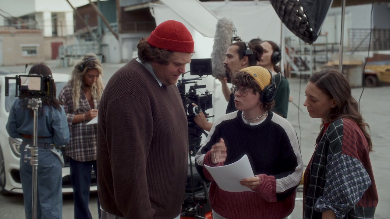 Actors Discussing Their Lines with Film Director on Outdoor Movie Set