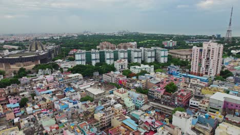 government medical college and hospital in madras with crowded residentials buildings in anna salai, triplicane, chennai, tamil nadu day time push back drone shot