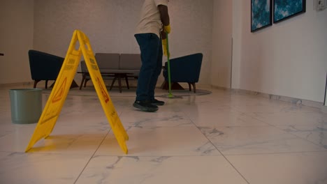 cleaner using mops, cleaner with mop and uniform cleaning hall floor