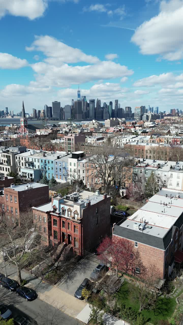 Vertical drone footage of Clinton Street in Brooklyn with a pull-away shot, revealing the street, buildings, and surrounding cityscape. Great for urban, real estate, and cinematic projects.