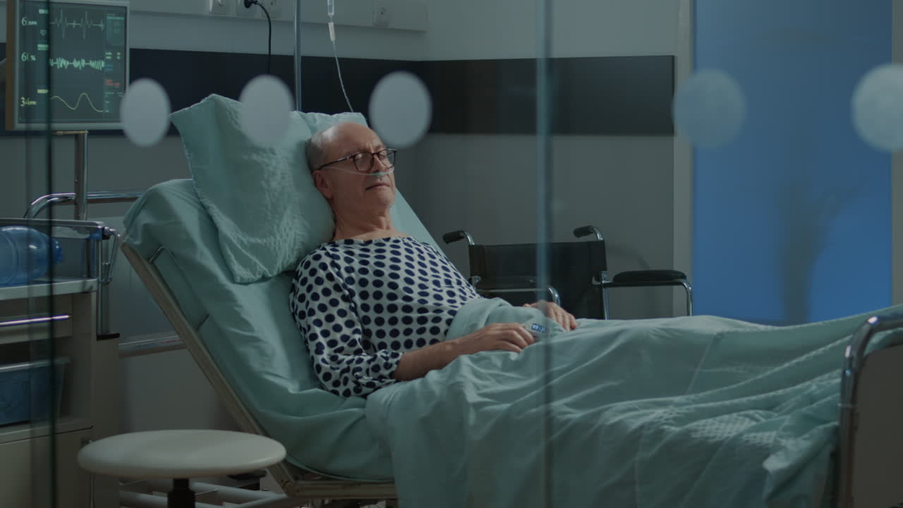 Patient with disease sleeping in hospital ward bed at facility