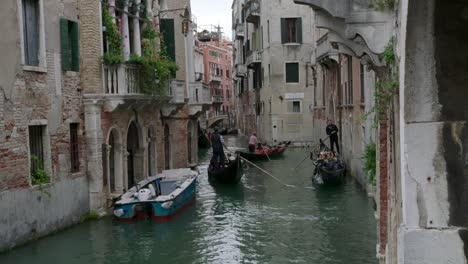 gondolas on a canal in venice, italy