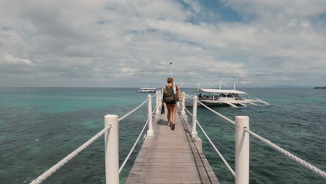 cinematic slow motion shot walking to an outrigger boat in the philippines with beautiful weater, 120fps, 4k, slomo