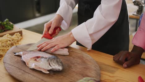 chef cutting a fish