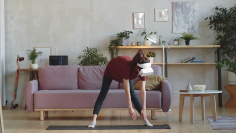 woman in vr headset doing stretching exercises at home