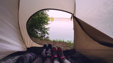 couple camping by the lake
