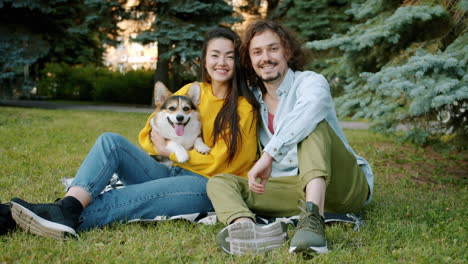 couple and dog in a park
