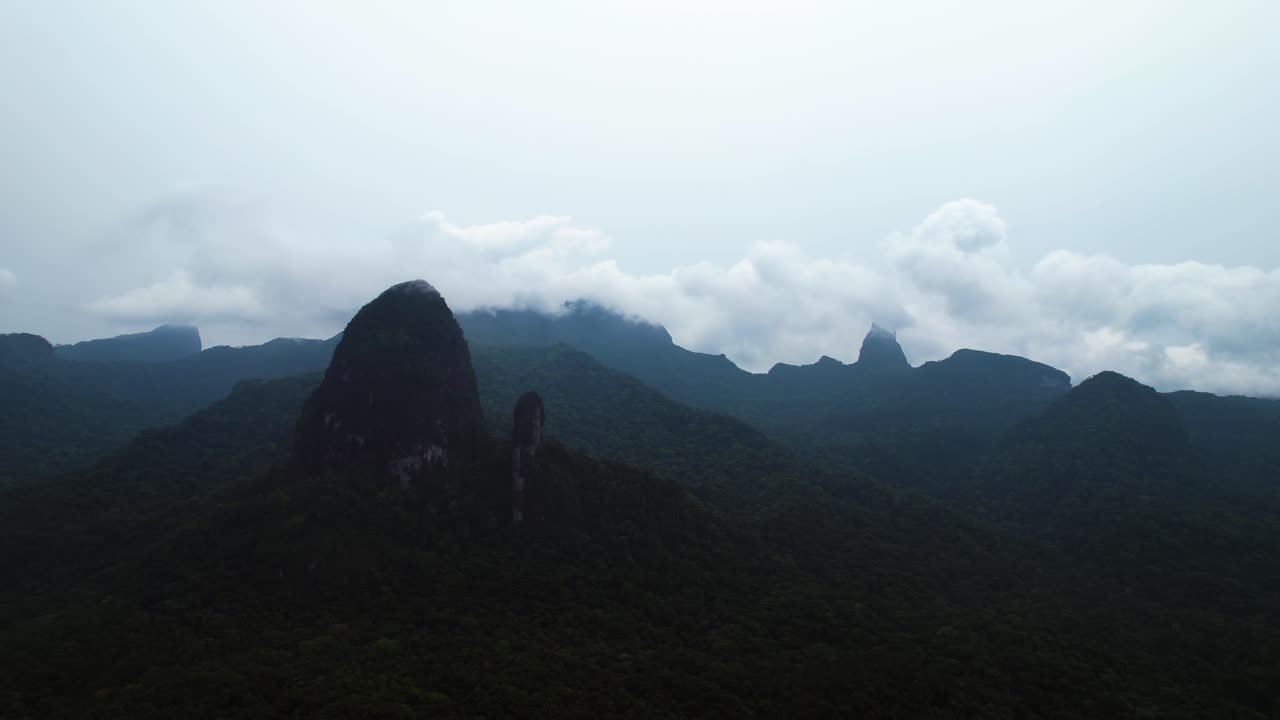 Panoramic drone shot around the João Dias Pai and Filho peaks on Principe island