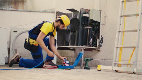 electrician doing hvac system checkup