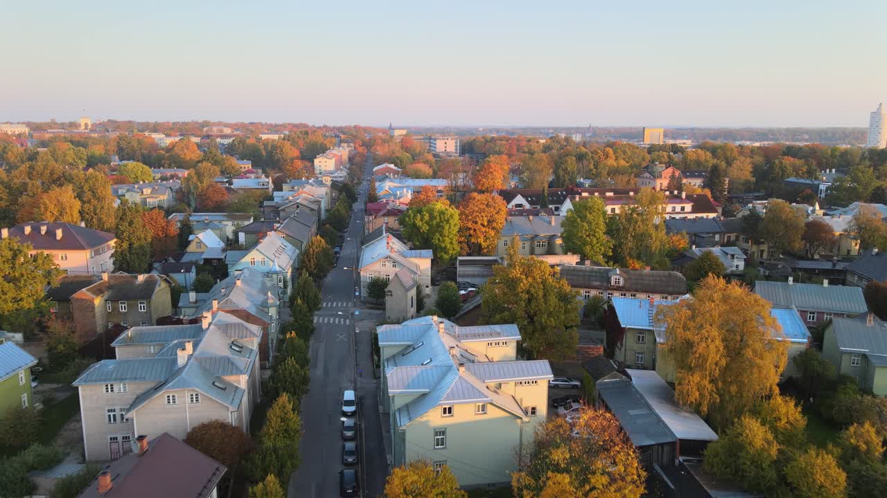 Drone shot of colorful houses of Karlova district during sunset in autumn