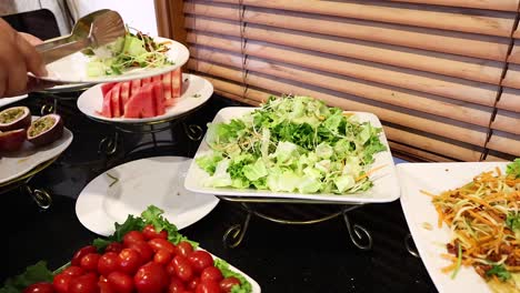 hands preparing a fresh vegetable salad