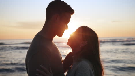 sunset, beach and couple hug