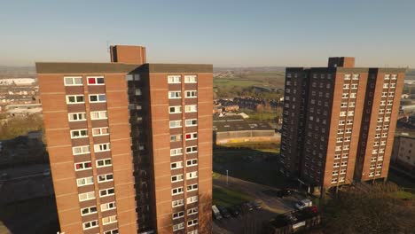 aerial footage view of high rise tower blocks, flats built in the city of stoke on trent to accommodate the increasing population, council housing crisis, immigration housing