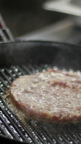 cooking a hamburger patty